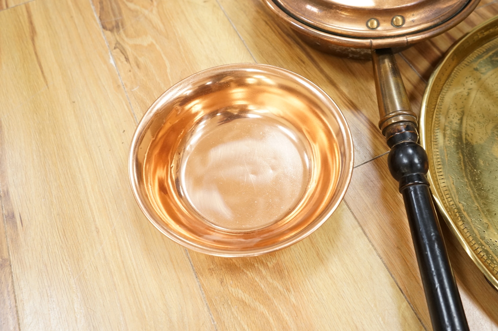 A group of metalware to include brass trays and copper warming pans